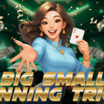 A cheerful animated woman in a blue outfit holds an Ace of Hearts card and reaches out with her hand. Dollar bills and confetti surround her in a vibrant casino-like background. Bold gold text reads "BIG SMALL WINNING TRICK."